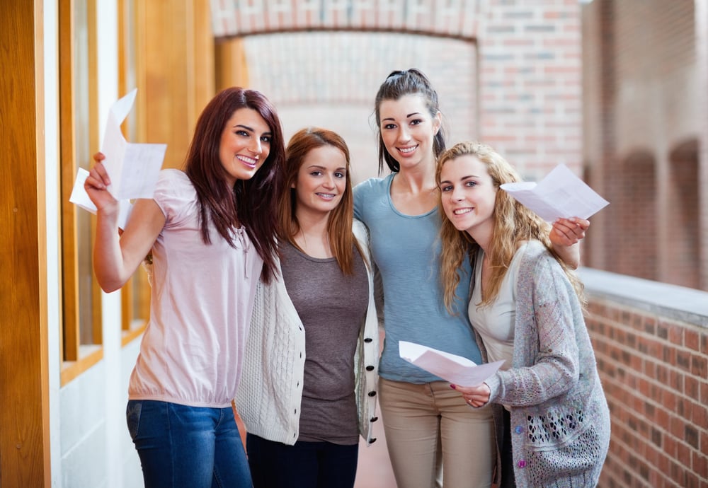 Students having their results in a corridor